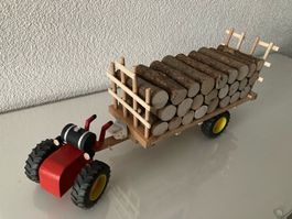Aebi Fahrzeug, m. Anhänger und Rundholz
