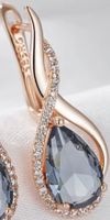 Elegante Ohrringe Roségoldplatziert mit blauem Stein - Neu