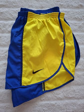 Shorts de course Nike homme bleu jaune taille L bon état