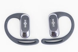 Écouteurs Bluetooth Shokz dans boitier chargeur USB