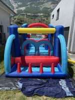 Château gonflable avec toboggan aire de jeux enfant