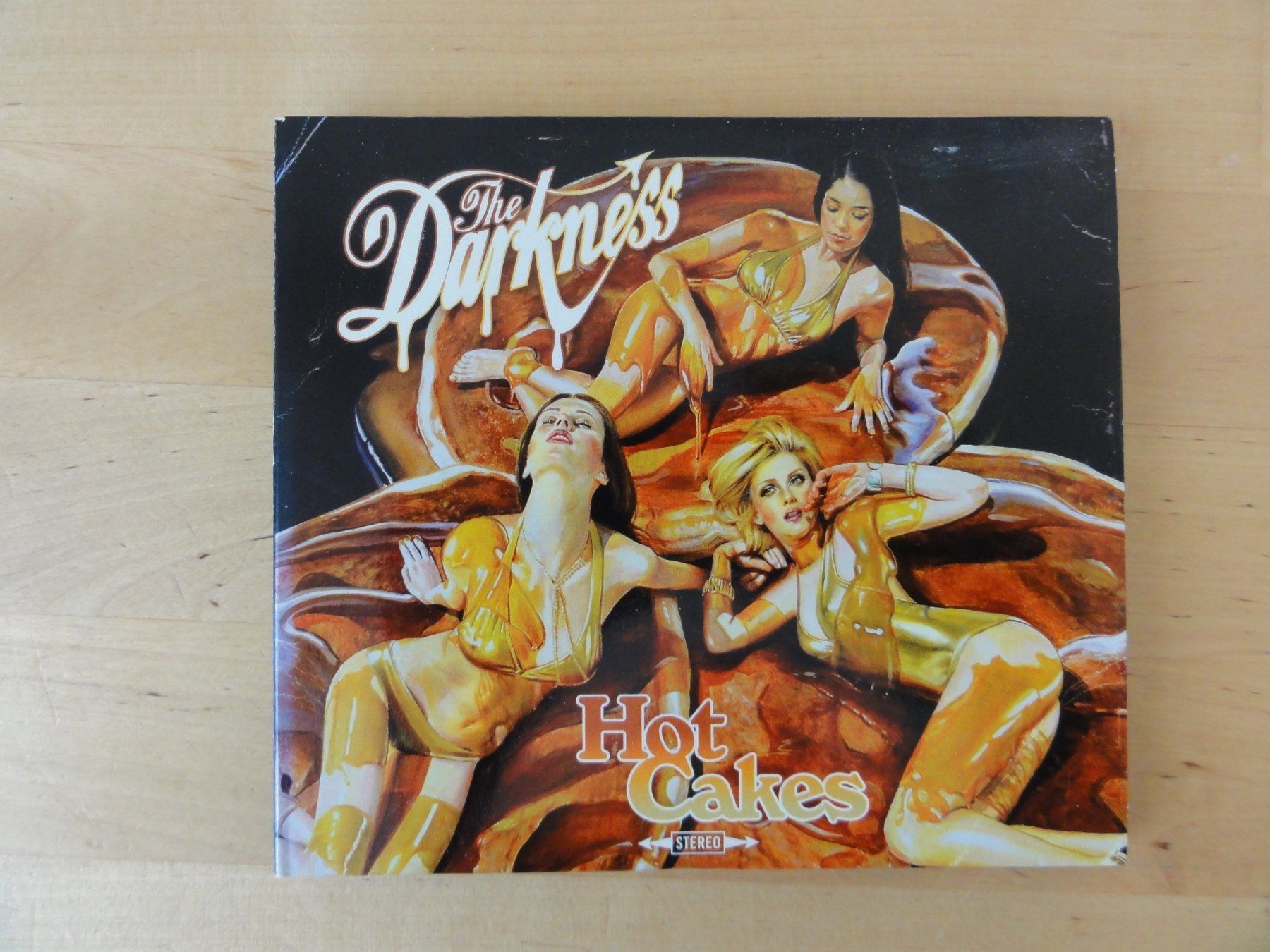 CDs: THE DARKNESS "Hot Cakes" – D'occasion à zürich par Goldimmund