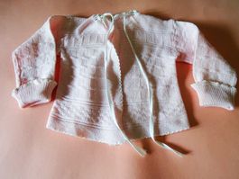 Älteres Babyschlüttli aus feinem rosa Baumwollgarn