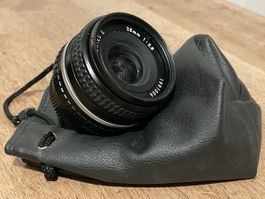 Nikon Series E Objektiv 28mm 1:2.8 mit Ledertasche