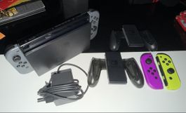 switch 1 avec 2 manette de + et 2 portes manettte.