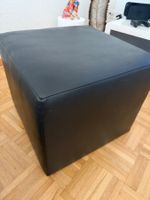Schwarze Lederhocker
