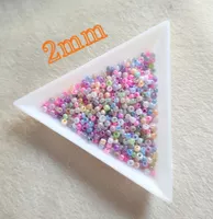 10g pastellfarbene glänzende Ceylon Glas-Rocailles 2mm