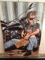 Harley-Davidson Biker mit Sturgis Schild
