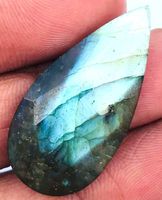 Cabochon L-2236 – Labradorit facettiert 33x16x5mm – 18 Karat