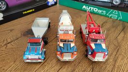 Lastwagen 2 International ERTL und 1 Matchbox 1:64