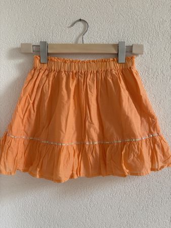 Jupe orange avec paillettes 9-10 ans