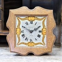 Pendule murale KIENZLE en céramique avec cadre bois sculpté