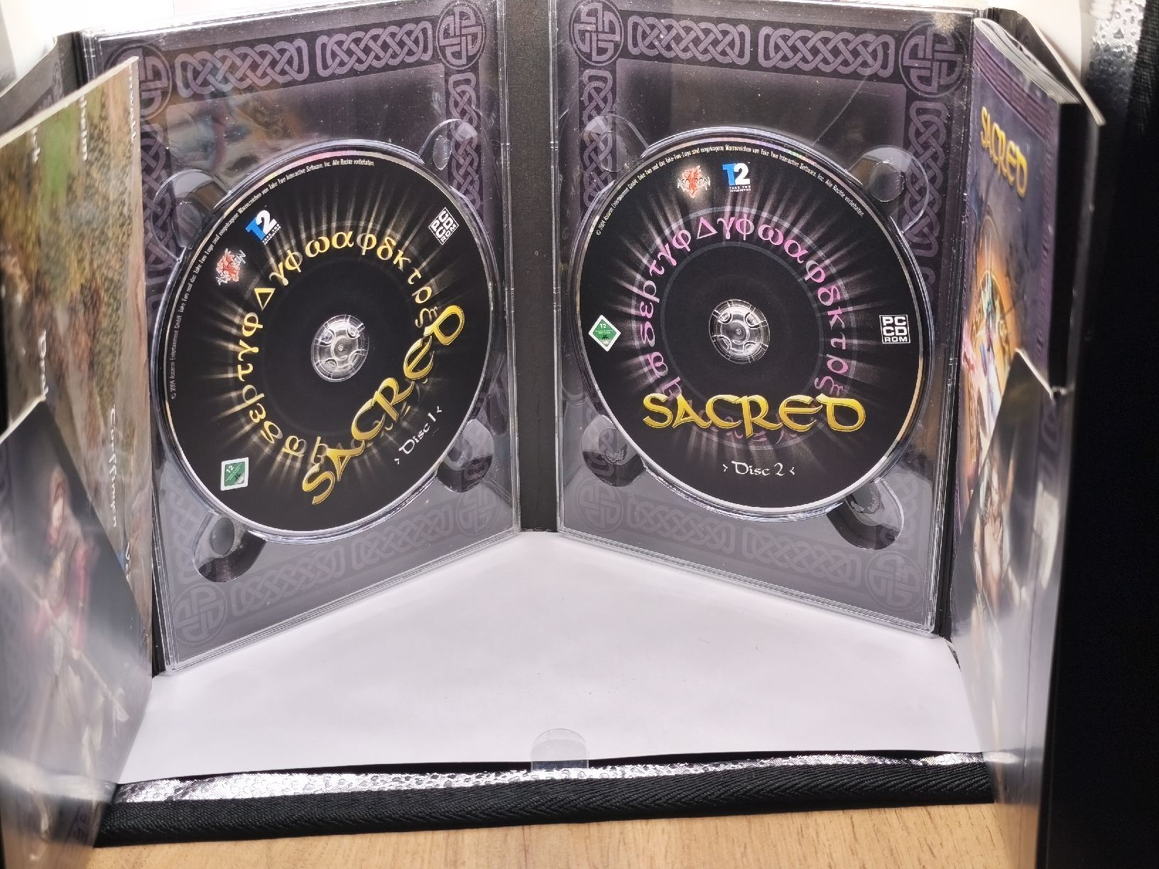 Spiele: Jeu PC SACRED édition platine, 2 CD-ROM, action RPG – Gebraucht aus Conthey von Th3gr4yf0x 2