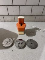 Elektrische Zyliss Scheibenraffel orange mit 3 Scheiben