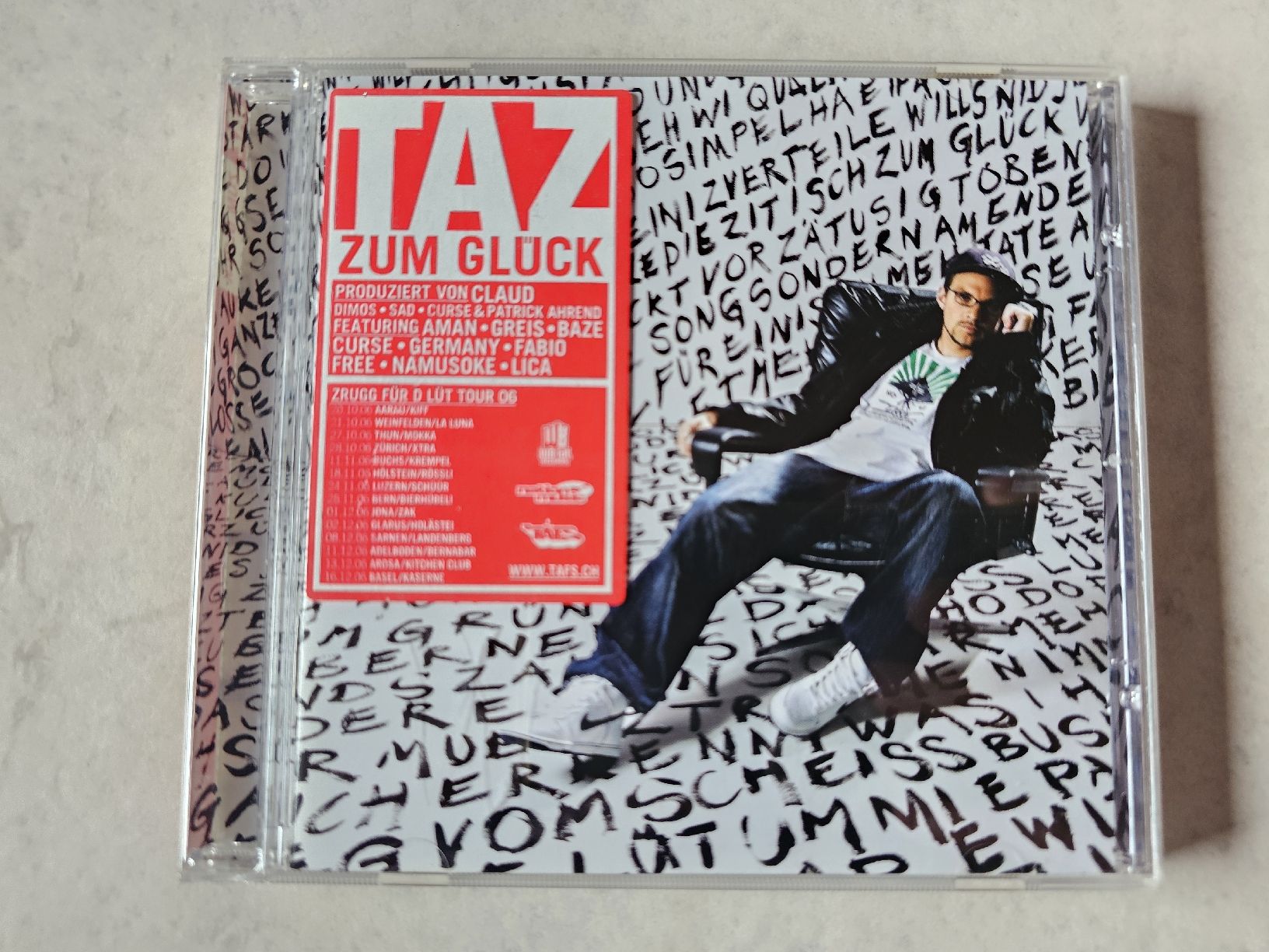CD: TAZ  -  Zum Glück – Usato da Schneisingen venduto da backstore24
