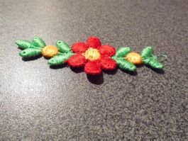 Blumen auf Stoff, rot/gelb