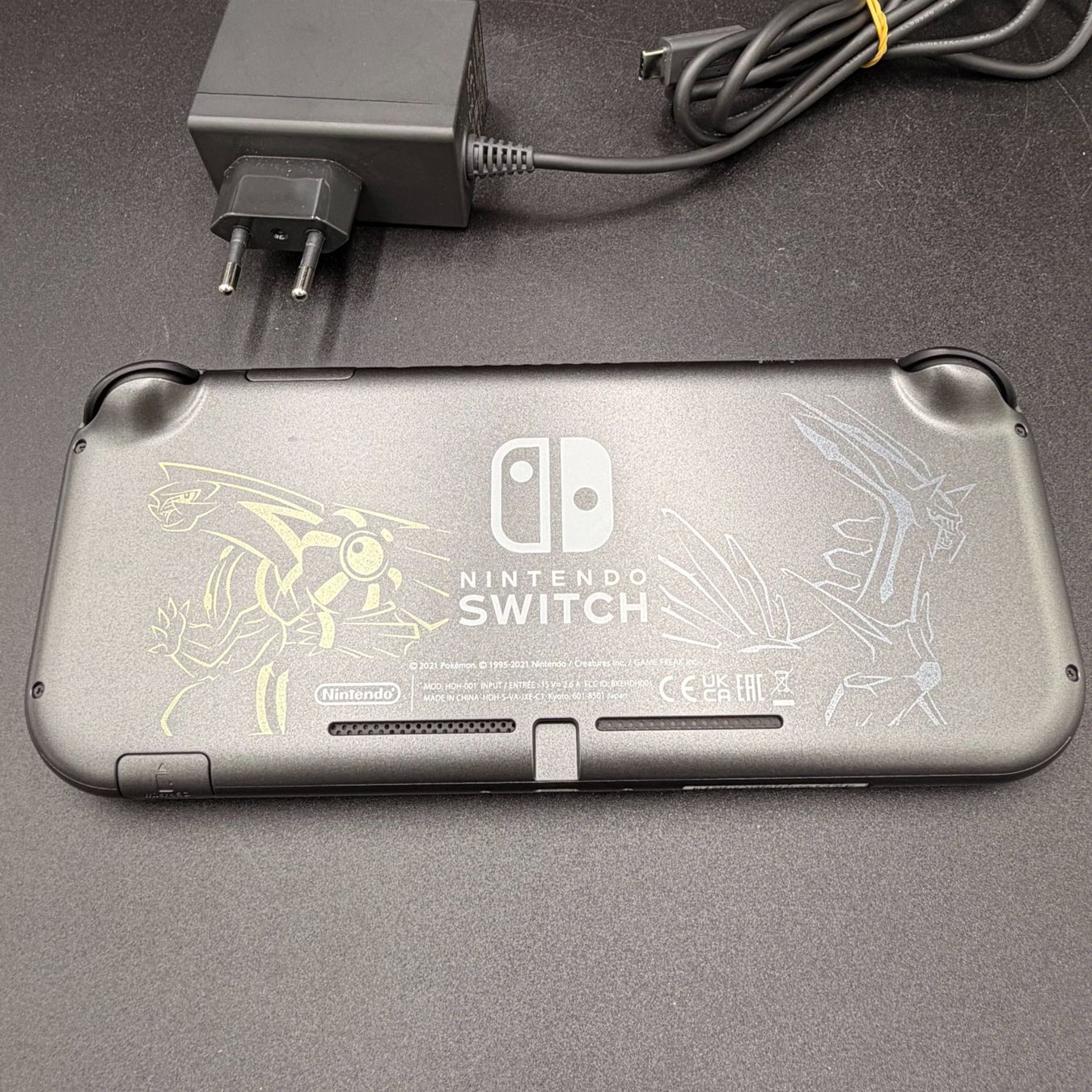 Nintendo Console: Nintendo Switch Lite Dialga & Palkia Edition mit Ladekabel – Usato da Düdingen venduto da Nerdworld 1