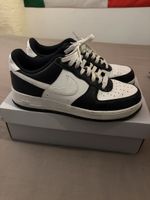 White and black Nike shoes, size 44