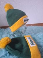 2x Ricola Mütze Neu – Grün Gelb Pompon Winter Merchandising