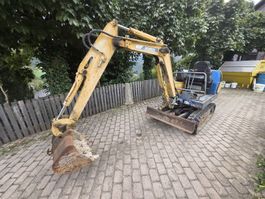 Hutter Bagger gelb gebraucht mit 2 Schaufeln