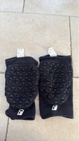 Coudières  noires taille XL état comme neuf