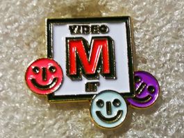Ansteckpin 67: Migros Video It