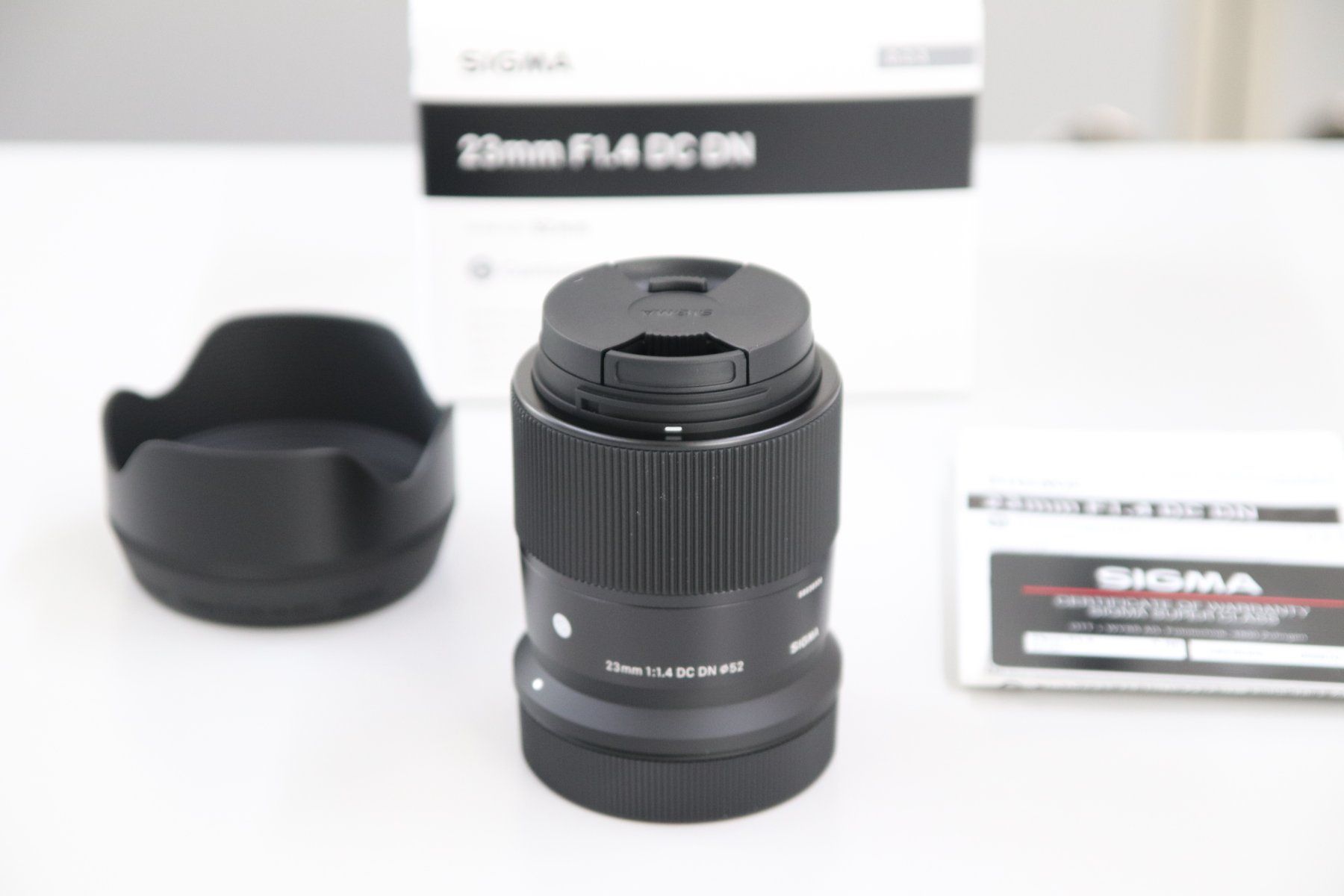 Sigma Obiettivi: Sigma 23mm 1.4 DC DN Canon RF-Mount / NEU – Nuovo e nell'imballaggio originale da Zofingen venduto da OWYSSAG
