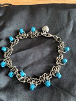 Joli bracelet argenté avec perles turquoises