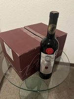 Vino merlot comano