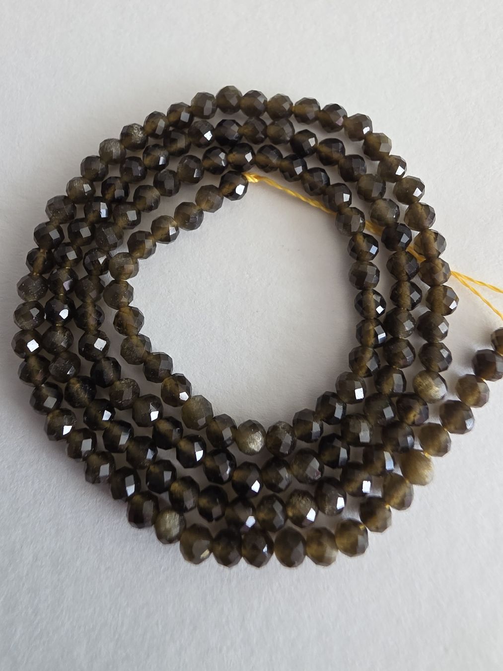 Minerali & Pietre curative: Obsidian facettiert 3mm. Strang – Nuovo e nell'imballaggio originale da Menziken venduto da Mirager