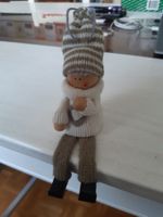 Winterkind mit Hängebeinen