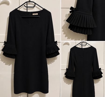 Elegantes schwarzes Kleid mit besonderen Ärmeln