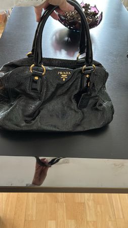 Black patent leather Prada handbag
