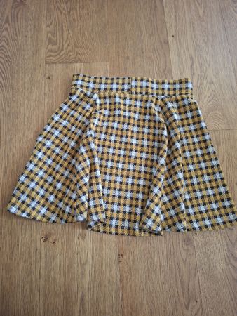 Jupe à carreaux jaune et noir taille M Ckh