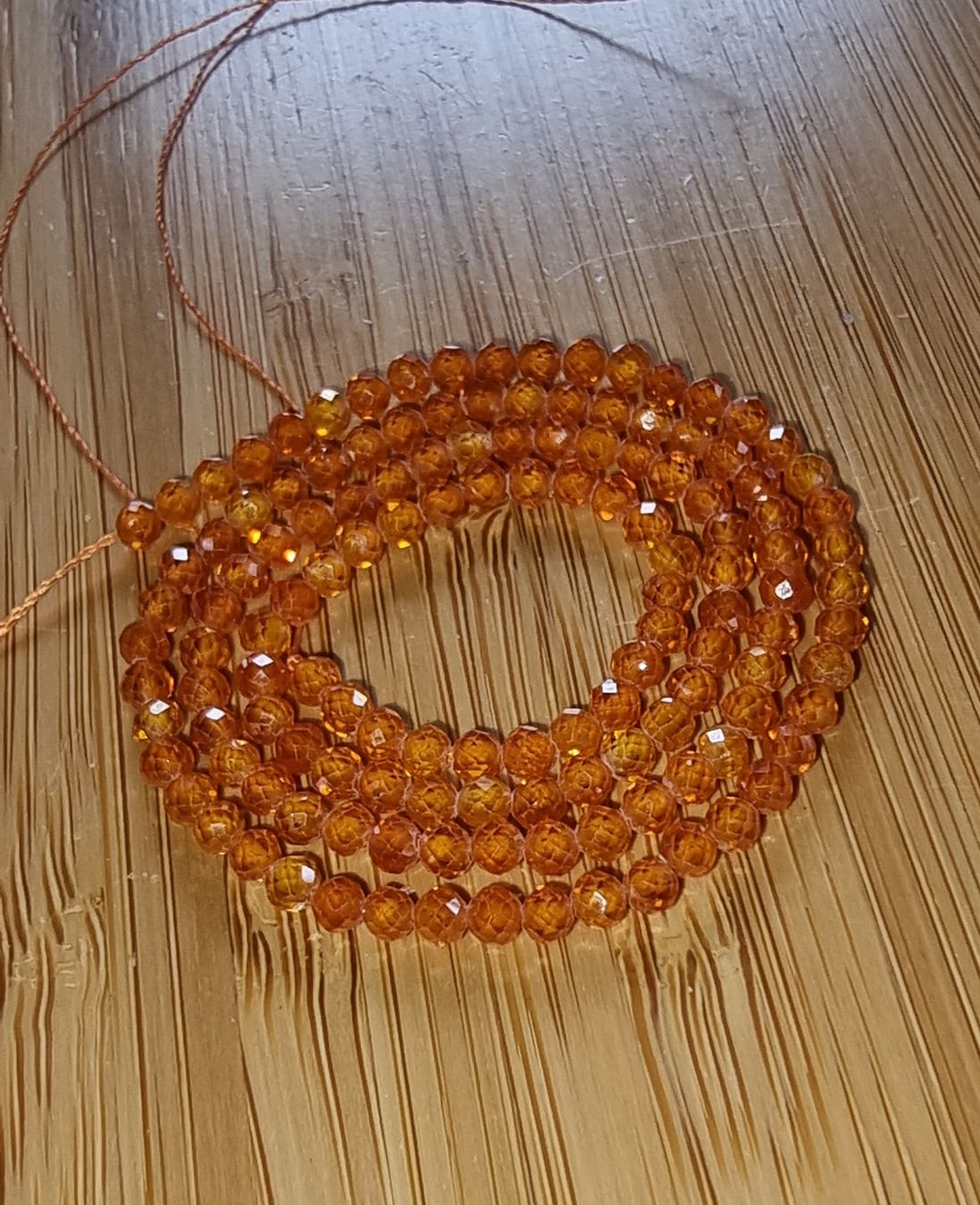 Minerali & Pietre curative: Zirkon Orange facettiert 3mm. Strang – Nuovo e nell'imballaggio originale da Menziken venduto da Mirager