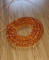 Zirkon Orange facettiert 3mm. Strang