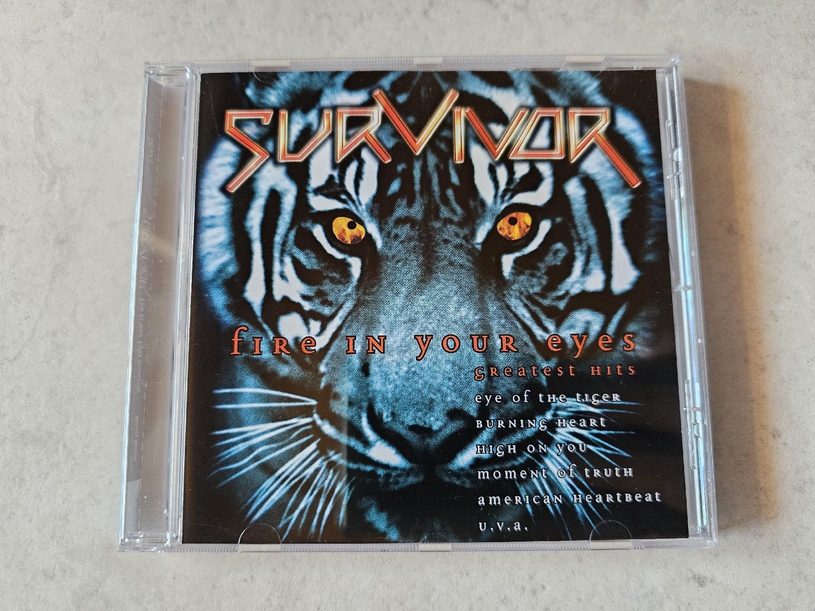 CDs: Survivor  -  Fire In Your Eyes  /  Greatest Hits – Gebraucht aus Schneisingen von backstore24