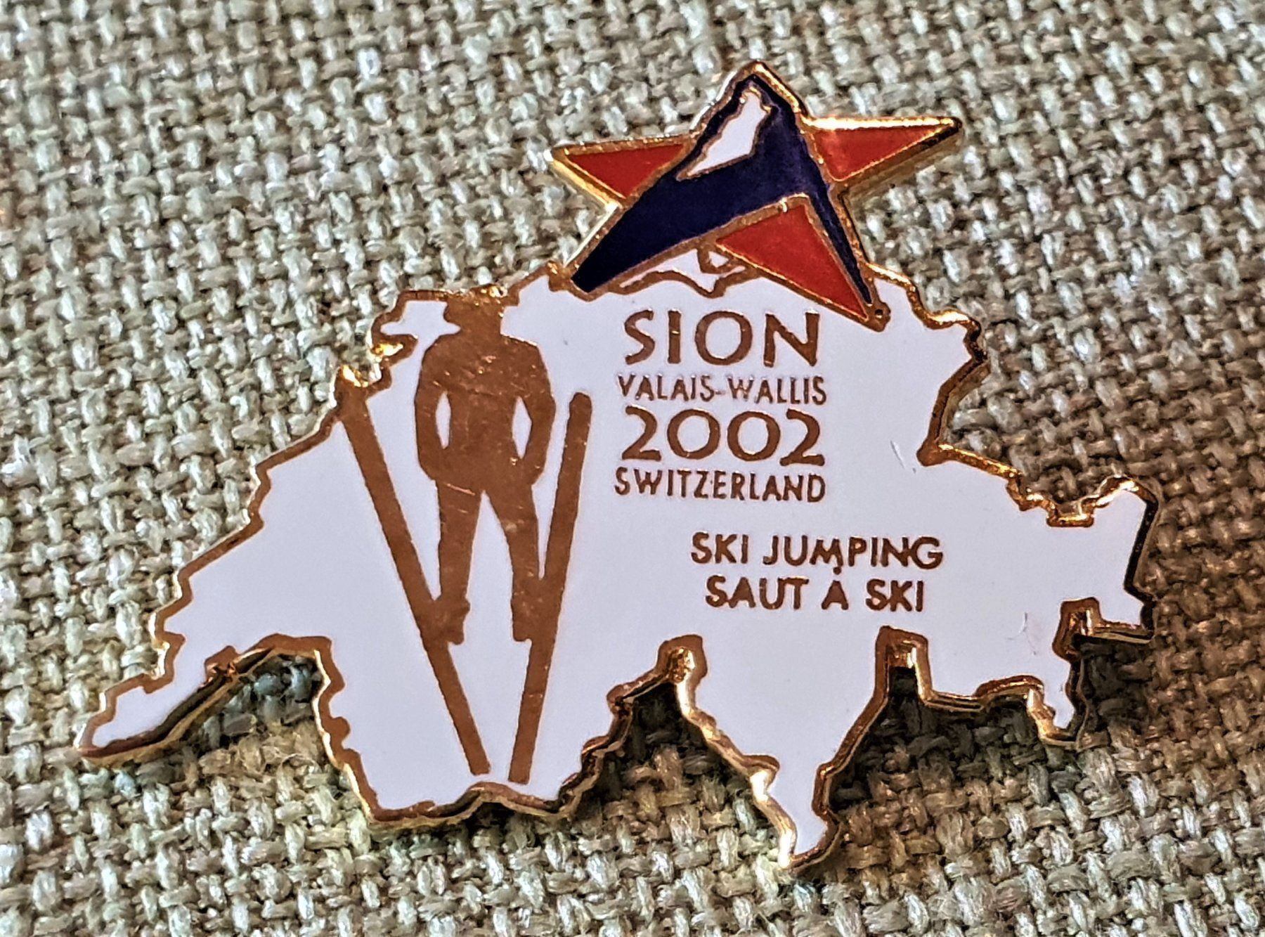 Medaglie: J343 - Pin Sion Wallis Valais 2002 – Usato da Reinach BL venduto da Boston-Verkauf