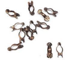 Vorhangklammern aus Messing - Pinces en laiton pour rideaux