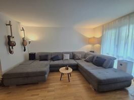 Graues Ecksofa aus Stoff mit Stauraum 