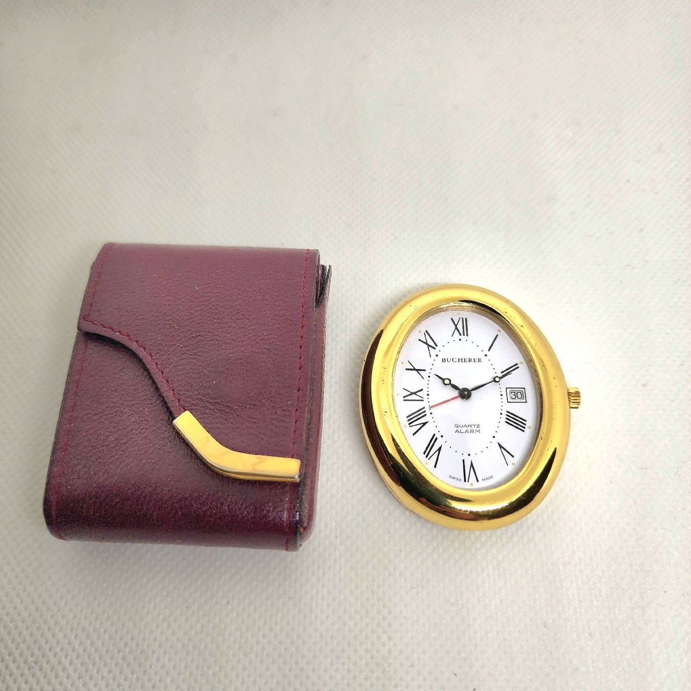 Bucherer Sveglie: Pendulette Bucherer quartz avec étui – Usato da Vevey venduto da var_5d8n 4
