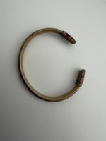Armreif Messing Optik mit roten Steinen gebrauchte cht