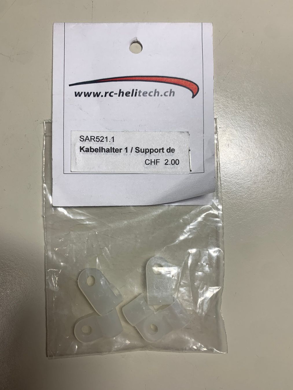 Modellismo RC: RC Heli Kabelhalter d 5mm – Nuovo e nell'imballaggio originale da Dornach venduto da Hofleur