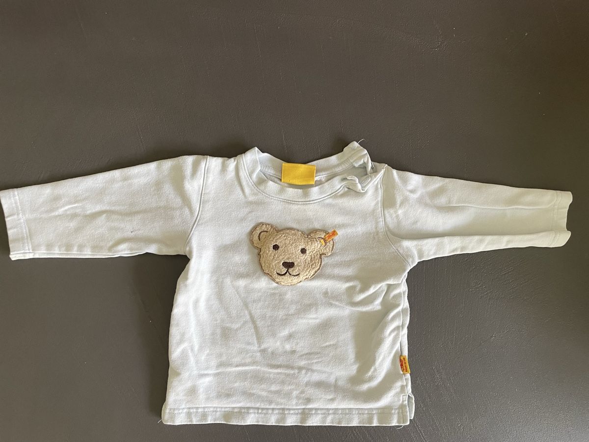 Steiff Pulls et sweat-shirts: Steiff Pullover hellblau in Gr 74 – D'occasion à Maienfeld par viola93