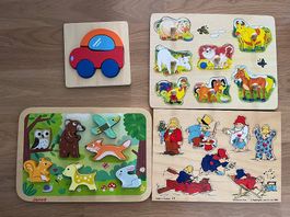 Vier verschiedene Steckpuzzles aus Holz für Kinder