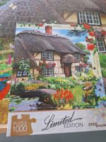 1000 Puzzle " Schönes Landhaus ", Dach mit Ried bedeckt.