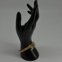 Bracelet serpent doré en métal, design têtes multiples