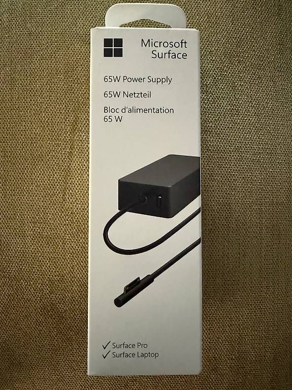 Chargeur: Original Microsoft Surface 65W Netzteil  NEU & ungeöffnet – D'occasion à Magden par Danielg1