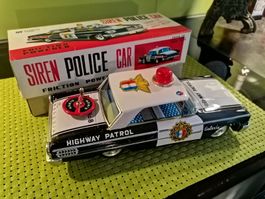 Blechsplelzeug Polizeiauto Japan ASC Mit sirene zum Drehen.