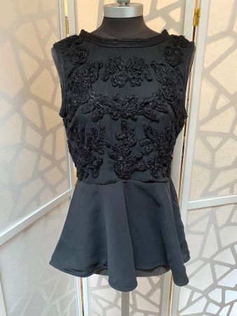 Beautiful black embroidered top with peplum. S